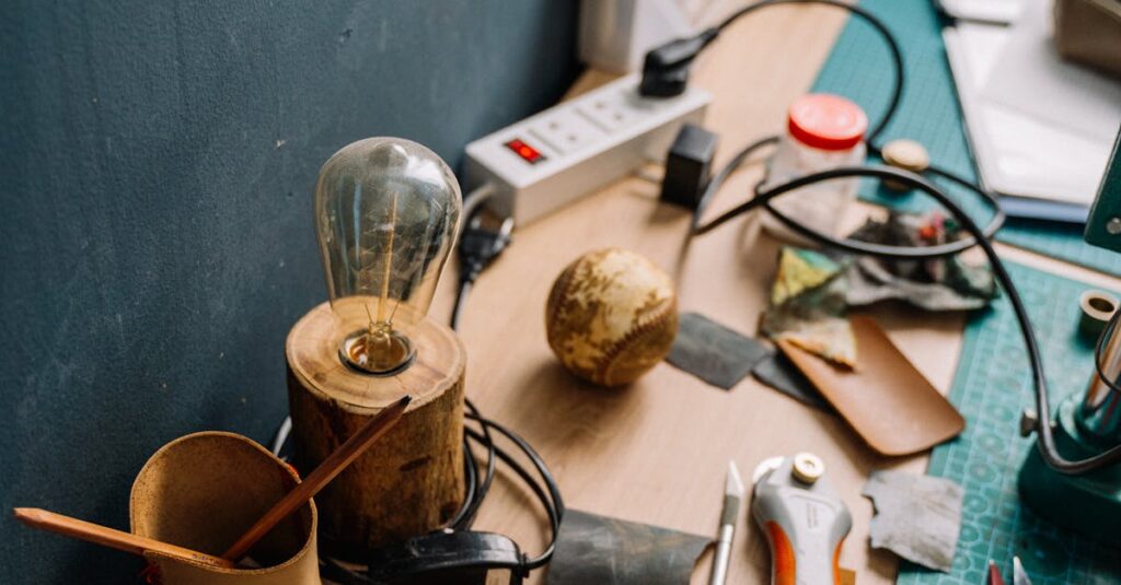 A cluttered workbench showcasing various tools and supplies for creative projects.